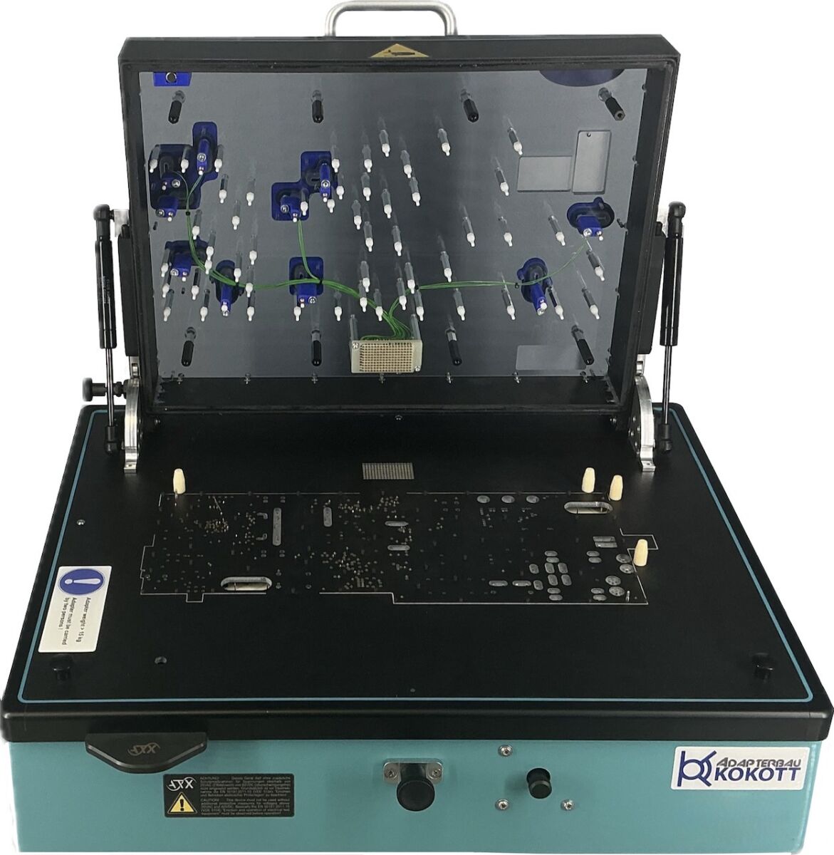 Geöffneter ATX Teradyne TS12x Vakuumadapter mit Leiterplattenaufnahme, Kontaktstiften und transparenter Oberseite.